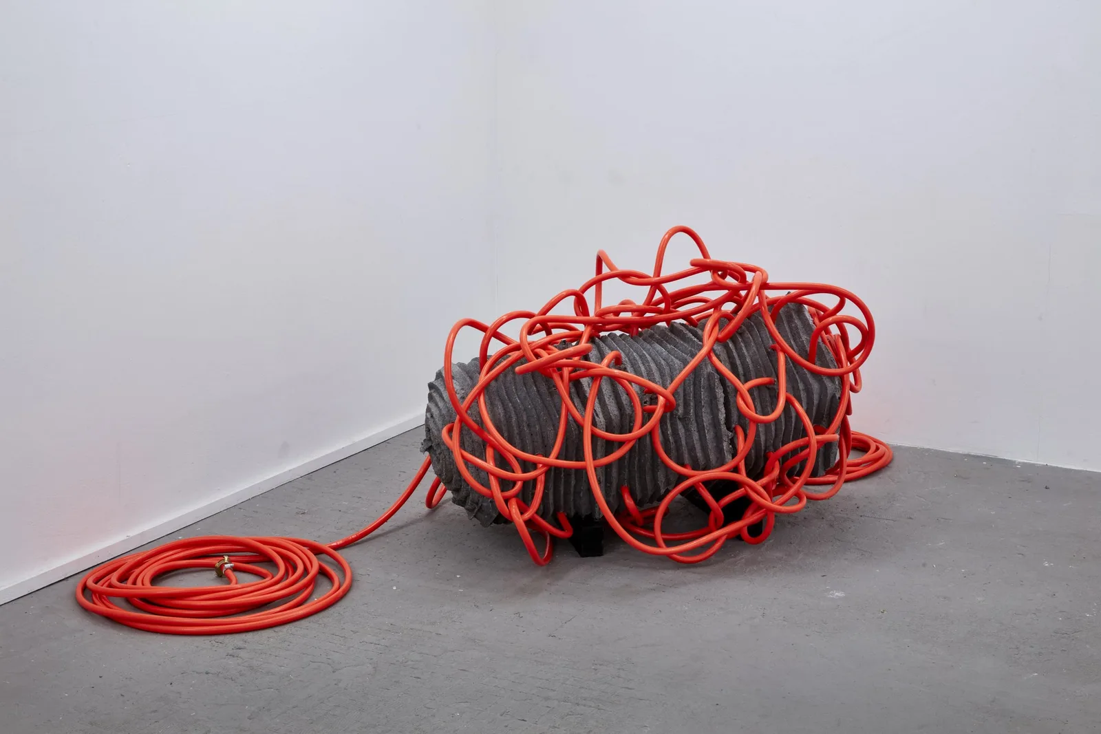 Jáchym Fleig, Winding, 2022. Cement and flexible hose · 70 × 70 × 60 cm