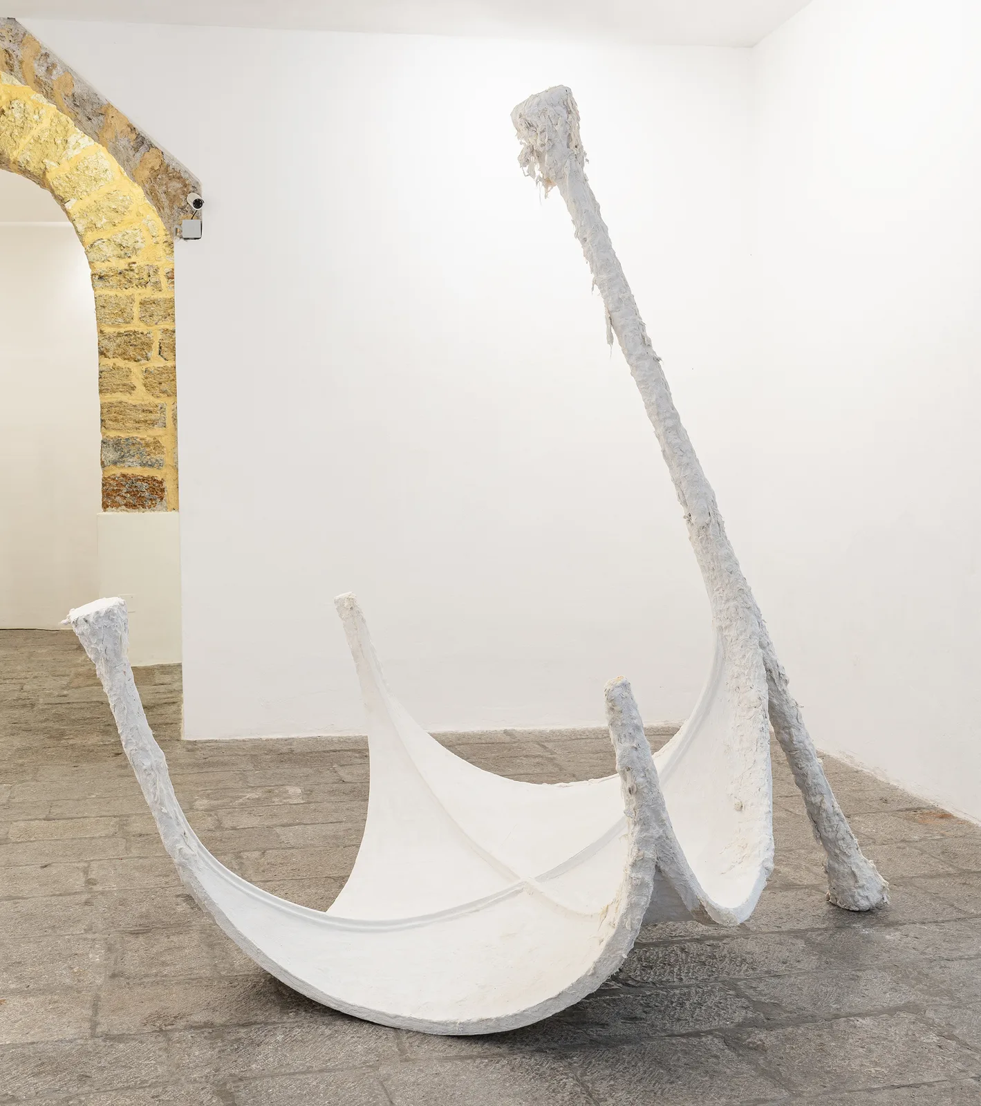 Francesca Polizzi, Volta, 2026. Plaster, raw wool and iron · 245 × 180 × 180 cm